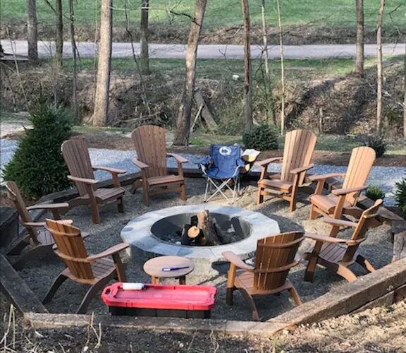 Newly constructed fire pit has 8 Adirondack chairs and room for additional lawn chairs